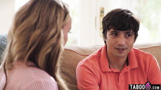 Couple mid-scene in a dim bedroom