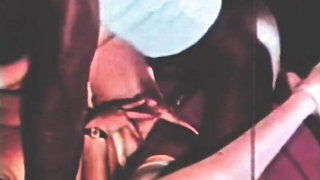 Explicit massage scene in a softly lit room