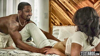 Explicit massage scene in a softly lit room