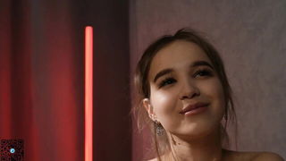 Explicit massage scene in a softly lit room