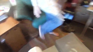 Couple on a made bed in an explicit scene