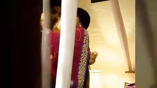 Couple mid-scene in a dim bedroom