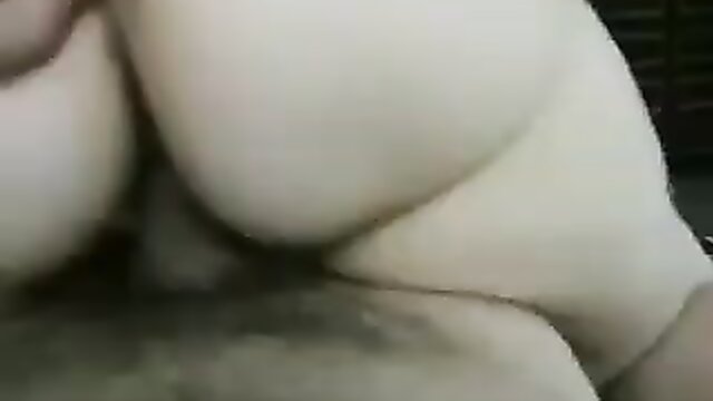 Performers on a leather sofa in a Cowgirl Creampie sex scene
