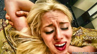 Explicit massage scene in a softly lit room