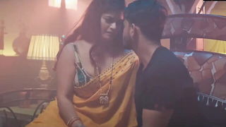 Studio set with performers in an explicit scene under bright lights