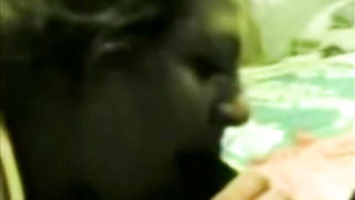 Explicit massage scene in a softly lit room