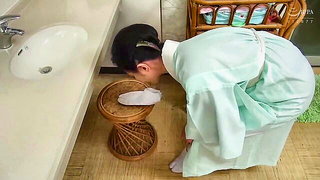 Solo performer with a toy on rumpled bedsheets