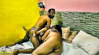 Couple mid-scene in a dim bedroom
