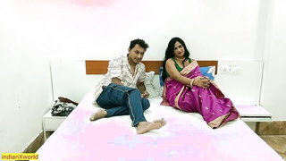 Couple on a patterned bedspread in an explicit scene