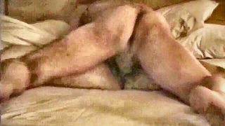 Explicit doggy style scene on a wide bed