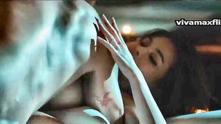 Amateur couple on a living room sofa in explicit scene