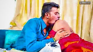 Couple mid-scene in a dim bedroom