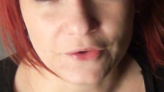 Amateur couple on a living room sofa in explicit scene