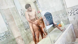 Couple mid-scene in a dim bedroom