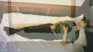 Pair of performers in motion on a wide bed