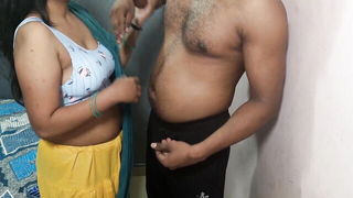 Couple on a made bed in an explicit scene