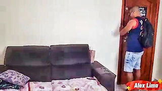 Couple on a made bed in an explicit scene