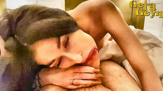 Couple on a patterned bedspread in an explicit scene