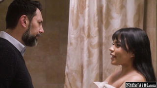 Explicit massage scene in a softly lit room