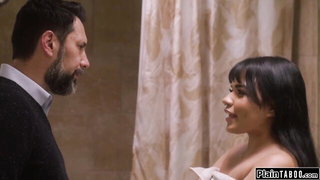 Explicit massage scene in a softly lit room