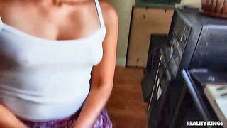 Amateur couple on a living room sofa in explicit scene