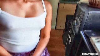 Amateur couple on a living room sofa in explicit scene