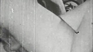 Couple mid-scene in a dim bedroom