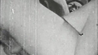 Couple mid-scene in a dim bedroom