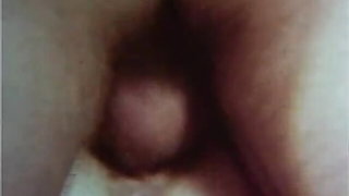 Explicit massage scene in a softly lit room