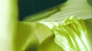 Close frame of an explicit scene in sharp indoor light