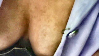 Explicit massage scene in a softly lit room
