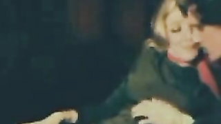 Explicit massage scene in a softly lit room