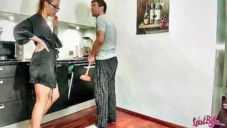 Amateur couple on a living room sofa in explicit scene
