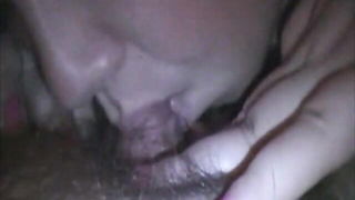 Couple mid-scene in a dim bedroom