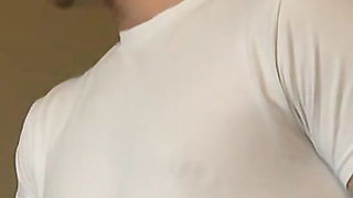 Amateur couple on a living room sofa in explicit scene