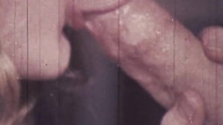 Amateur couple on a living room sofa in explicit scene