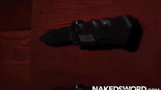 Couple on a made bed in an explicit scene