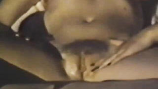 Explicit massage scene in a softly lit room