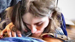Solo performer with a toy on rumpled bedsheets