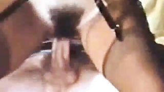 Explicit massage scene in a softly lit room