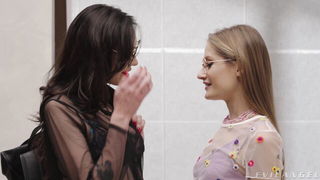 Couple mid-scene in a dim bedroom