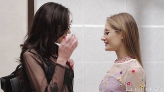 Couple mid-scene in a dim bedroom