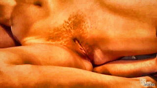 Amateur couple on a living room sofa in explicit scene