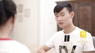 Explicit massage scene in a softly lit room