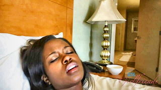 Couple mid-scene in a dim bedroom