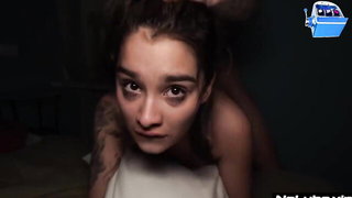 Couple mid-scene in a dim bedroom