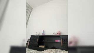 Couple on a made bed in an explicit scene