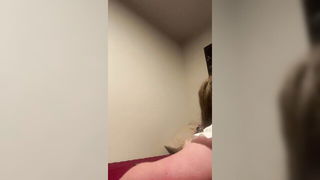 Amateur couple on a living room sofa in explicit scene