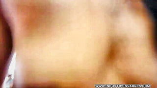 Amateur couple on a living room sofa in explicit scene