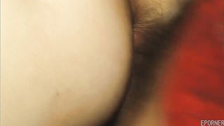 Couple mid-scene in a dim bedroom